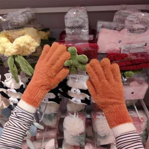 Orange fluffy knit touch screen gloves for women winter warmth daily wear stylish.