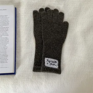 Women's long knit gloves with lace label, warm dark grey wool blend for autumn and winter daily wear.