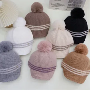 Japanese style striped knitted hat with plush pom pom, warm winter beanie for women.
