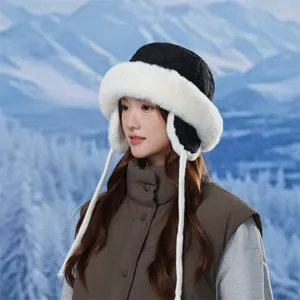 Detailed view of the warm winter quilted trapper hat with soft faux fur lining and ear flaps.