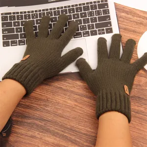Detailed view of mens thermal knit gloves in military green, touchscreen friendly design.