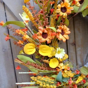 Autumn harvest thanksgiving floral wreath with sunflowers for front door wall decor.