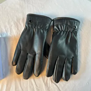 Black leather touchscreen winter gloves featuring warm fleece lining for cold cycling.