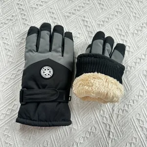 Close-up of winter thermal ski gloves detail showing warm plush lining and adjustable strap.