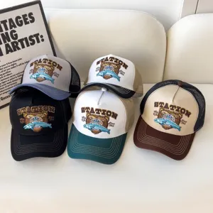 Close-up of American vintage mesh baseball cap featuring embroidered bear and breathable design.
