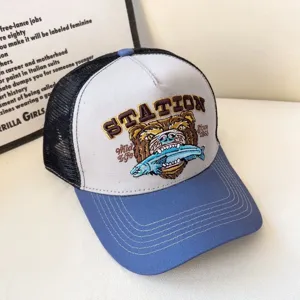 Vintage trucker baseball cap with embroidered bear and fish graphic, breathable mesh back.
