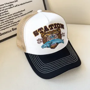 American retro trucker hat with embroidered bear graphic, breathable mesh back and curved brim.