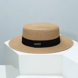 Summer flat top straw hat with wide brim and black ribbon band for outdoor sun protection.