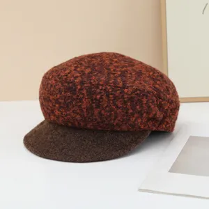 Textured loop yarn wool newsboy hat detail, brown retro warm autumn winter beret cap.