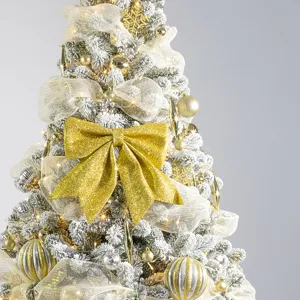 Luxury gold Christmas tree decoration set featuring a large glitter bow and ornaments