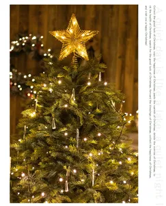 Exquisite gold iron Christmas tree topper star with glowing warm LED lights detail