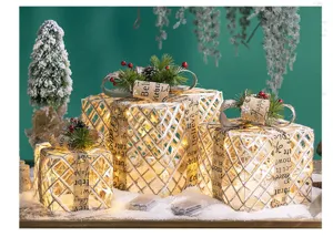 Set of 3 glowing iron mesh Christmas gift box decorations with warm LED lights detail view