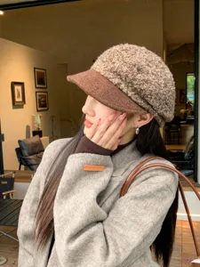 Detailed view of the retro boucle spliced woolen soft-brim beret, elegant autumn winter hat.