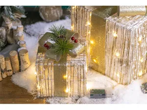 Detailed view of luminous iron frame Christmas gift boxes in a festive snowy scene