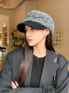 Stylish boucle woolen newsboy cap detail, retro warm autumn winter beret hat for women.