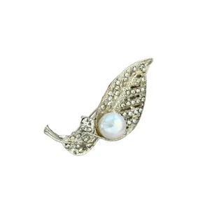 Elegant pearl leaf brooch with sparkling rhinestones, stylish metal pin for women apparel.