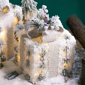 Lighted Christmas gift boxes decor with snow and burlap bow