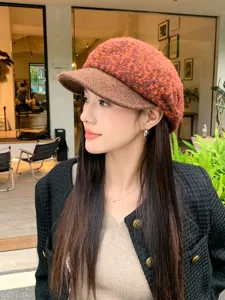Detailed close-up shot of the textured boucle and wool blend newsboy hat in autumn style.