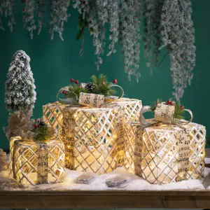 Set of 3 glowing iron Christmas gift boxes with burlap ribbons and LED lights
