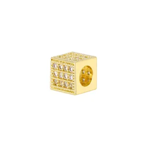 Detailed macro view of 18K gold-plated cubic spacer bead with sparkling cubic zirconia