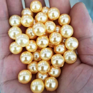 Golden shell pearl half-hole beads for DIY handmade jewelry and earring accessories.