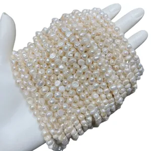 Natural white freshwater Baroque pearl loose beads held in hand for DIY jewelry making