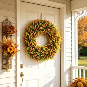 Autumn artificial boxwood wreath hanging on a white front door as home wall decor.