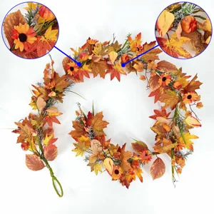 Detailed close-up view of autumn maple leaf garland with sunflowers and mini pumpkins