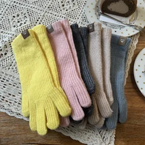 Korean style long knit winter gloves for women, solid color fingerless design with cute bear decor.