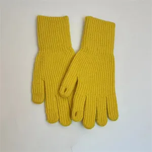 Detail shot of yellow knitted fingerless gloves with ribbed texture for autumn winter daily wear.