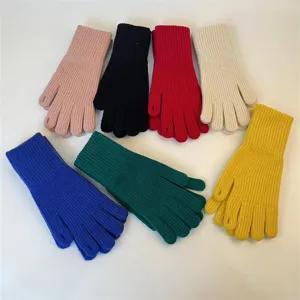 Multi-color knit winter gloves with touchscreen fingertips, warm and cozy cold weather gear.