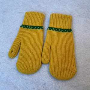 Close-up of cozy yellow winter knit mittens featuring green stripe pattern and warm design.