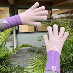 Pink and purple knitted winter gloves with long ribbed cuffs for warm daily wear and cold weather.