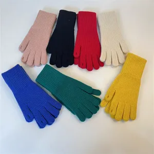 Detailed view of women knit winter gloves, multi-color ribbed warm touchscreen open finger design.