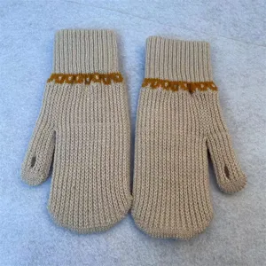 Women winter warm knit convertible mittens featuring stylish yellow pattern for cold weather.