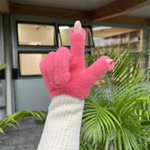 Detailed close-up of pink fingerless knit gloves with long beige ribbed sleeve warmers.