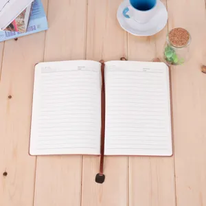 Classic A5 brown leather notebook with lined pages, ribbon bookmark, perfect for office use.