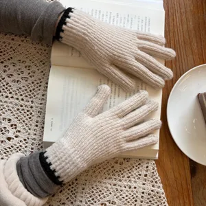 Knitted gloves for women, cozy winter thermal wear, stylish touchscreen friendly design.