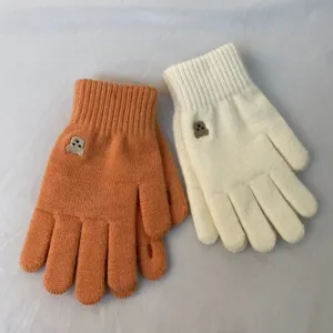 Cute bear embroidery knitted gloves detail showing cozy winter warm touchscreen wool fabric design.