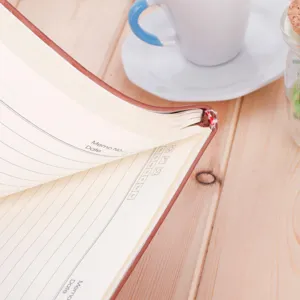 Premium A5 leather notebook for business office use, featuring lined pages and memo layout.