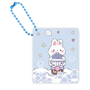 Mini carnet de poche portable avec chaîne de perles bleues, design lapin mignon buvant du thé.