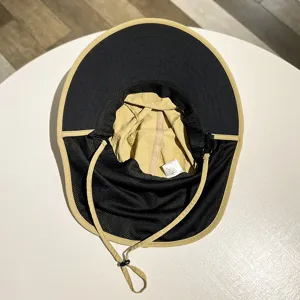 Outdoor sun protection hat with large brim and neck flap, ideal for hiking, fishing and travel.