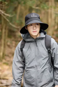 Outdoor hiking sun hat detail showing breathable mesh crown and wide brim for summer trekking.