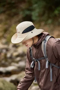 Outdoor sun protection bucket hat with breathable mesh for hiking and camping gear.