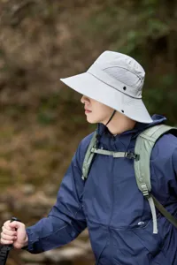 Outdoor sun protection bucket hat with wide brim, breathable, quick-drying for hiking.