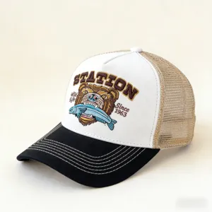 Close-up detail of the vintage mesh baseball cap featuring embroidered bear graphic and text.
