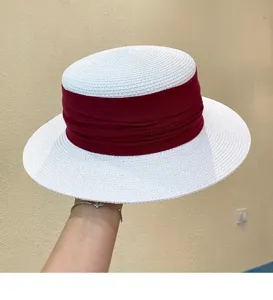 French vintage flat top straw hat with wide brim and burgundy ribbon for summer.