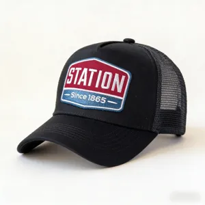 Detailed view of black trucker hat, mesh back and embroidered front patch for casual wear.