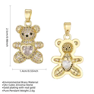 Close-up detail of a cute gold-plated bear pendant with sparkling cubic zirconia