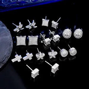 Detailed collection of iced-out silver stud earrings in various geometric and hip-hop styles.